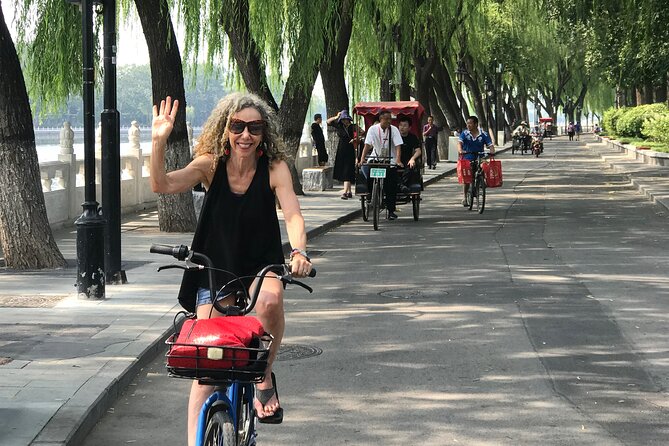 Beijing City Four-hour Bicycle Tour With a Private Guide - Drum and Bell Tower Square: Joining Local City Games