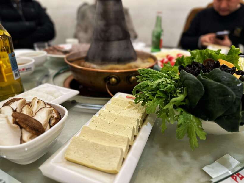 Beijing Hutong Food Crawl Delights: Peking duck, Hotpot&More - Peking Duck Stop: Crisp Skin, Tender Meat, and a Chef at Work