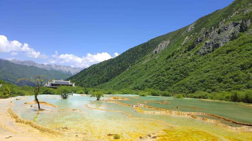 Huanglong Scenic Area: Explore Stunning Five-Colored Ponds - The Ponds That Earn Their Fame: terraced travertine colors