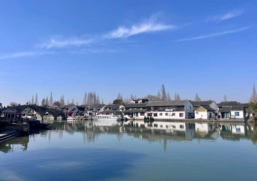 Shanghai: Zhujiajiao Water Town with Calligraphy Experience - The canal boat ride: calmer views, better perspective