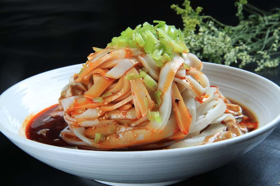 Xi'an: Gourmet & Street Food Tour - Muslim Street after dark: plum juice, candy makers, and real neighborhood flow