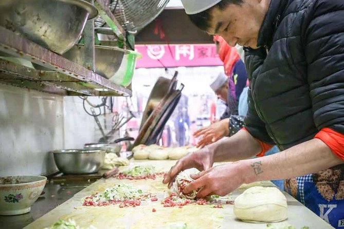 Xi'an Morning Food & Market Tour by TukTuk - Muslim Quarter morning: breakfast made fresh for the early crowd