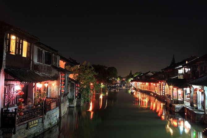 Xitang Water Village Sunset Tour with Riverside Dining Experience from Shanghai - Jinze Water Village: a calmer opening with canals and a boat ride