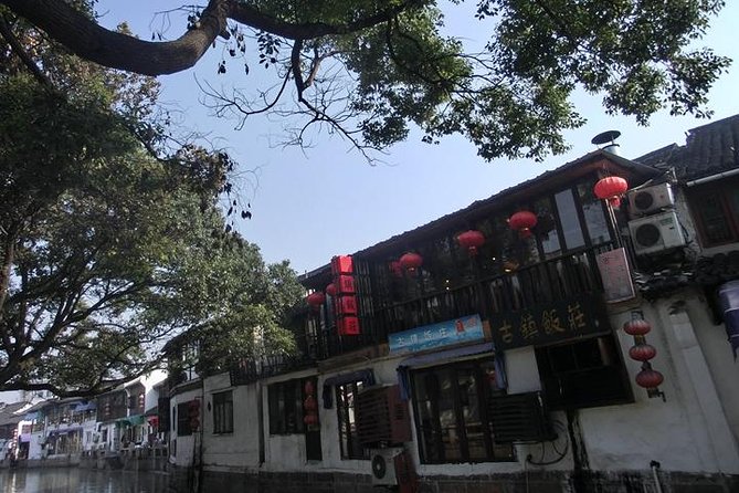 Zhujiajiao Water Town Tour including Huangpu River Night Cruise - Guide quality and group pacing: why it can make or break the day